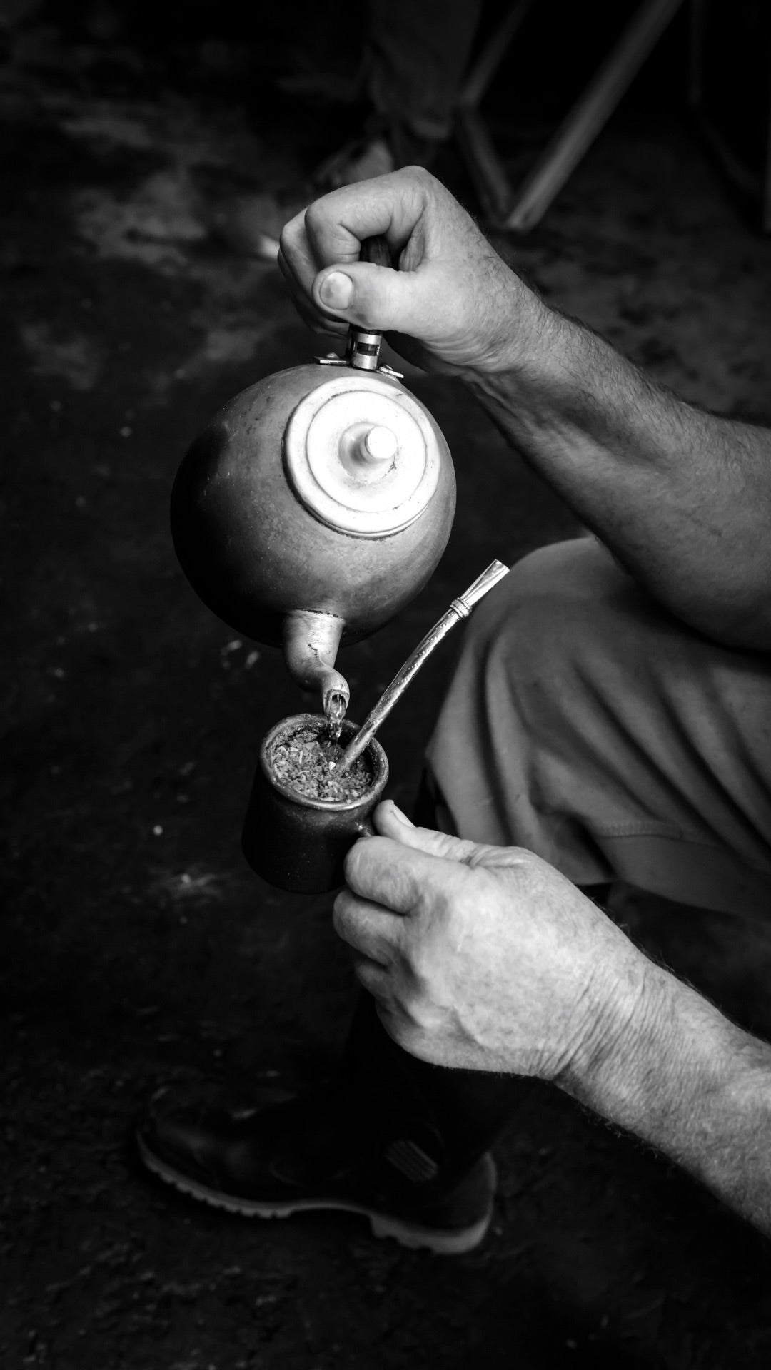 Pouring into a mate cup with a tea kettle