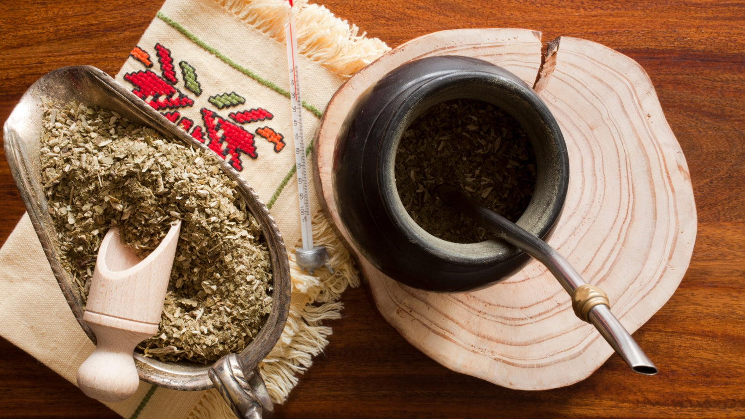 Yerba Mate Cup with Bombilla and loose yerba mate in a bowl with a serving spoon